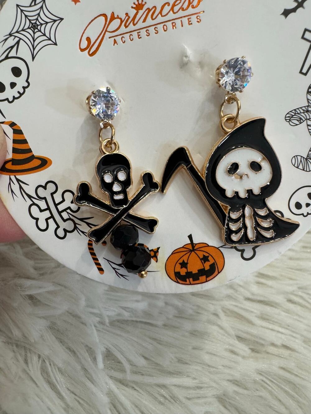 Halloween enamel earrings with skull and crossbones and skeleton design